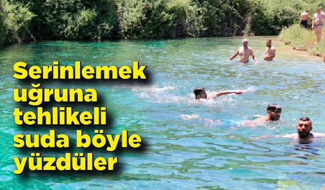 Serinlemek uğruna tehlikeli suda böyle yüzdüler