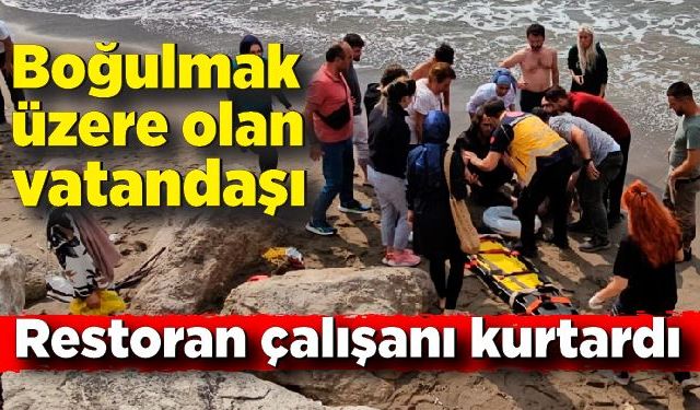 Denizde akıntıya kapılan vatandaşı boğulmaktan restoran çalışanı kurtardı