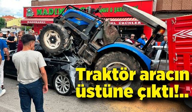 Freni boşalan traktör aracın üstüne çıkarak durabildi