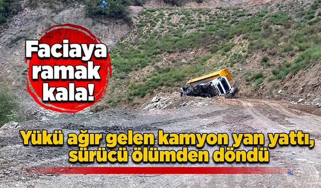 Yükü ağır gelen kamyon yan yattı, sürücü ölümden döndü