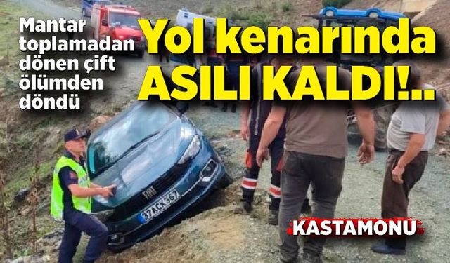 Otomobil yol kenarında asılı kaldı, araçtaki çift ölümden döndü