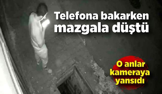 Telefona bakarken mazgala düştü: O anlar kameraya yansıdı