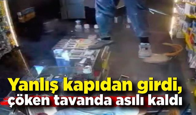 Yanlış kapıdan girdi, çöken tavanda asılı kaldı