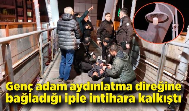 Aydınlatma direğine kendini asmaya kalkışan genci bekçiler kurtardı