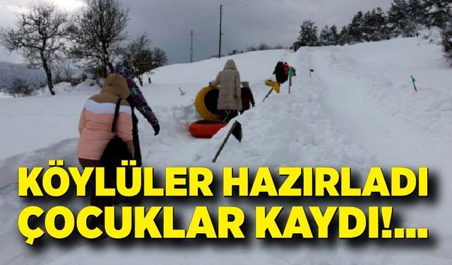 Kış eğlencesi: Çocuklar şambrelle kayarak doyasıya eğlendi