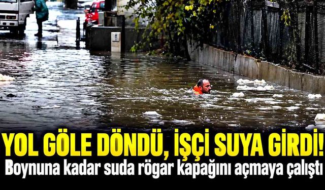 Boynuna kadar suya giren belediye işçisi, rögarın kapağını böyle açmaya çalıştı
