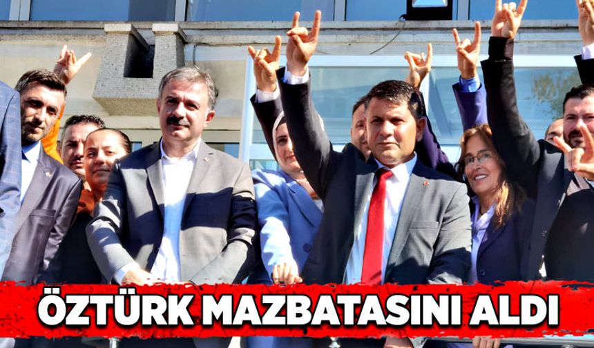 MHP  İl Başkanı Mustafa Öztürk mazbatasını aldı