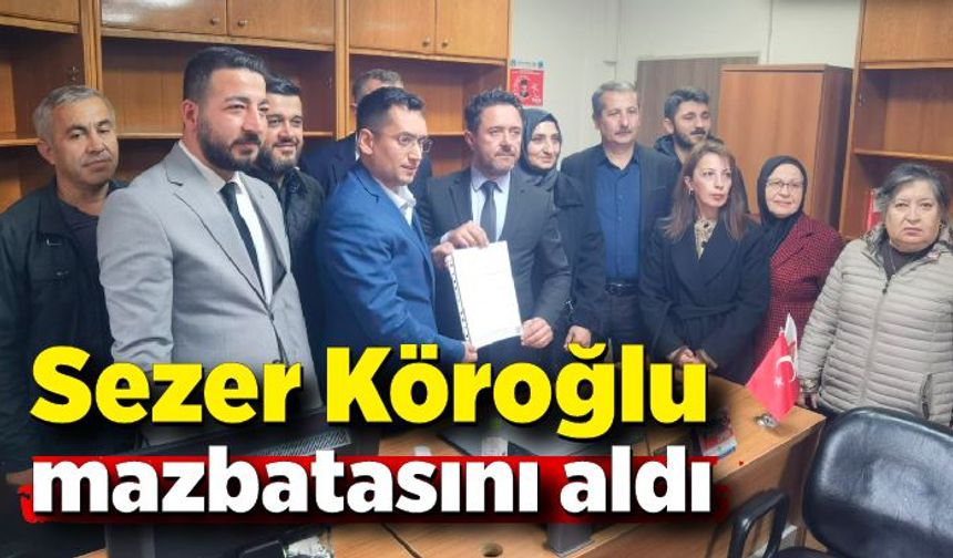 AK Parti Merkez İlçe Başkanı Sezer Köroğlu mazbatasını aldı.