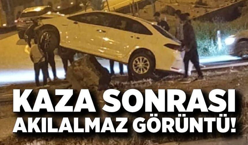 Kaza sonrası akılalmaz görüntü! Otomobil havada asılı kaldı
